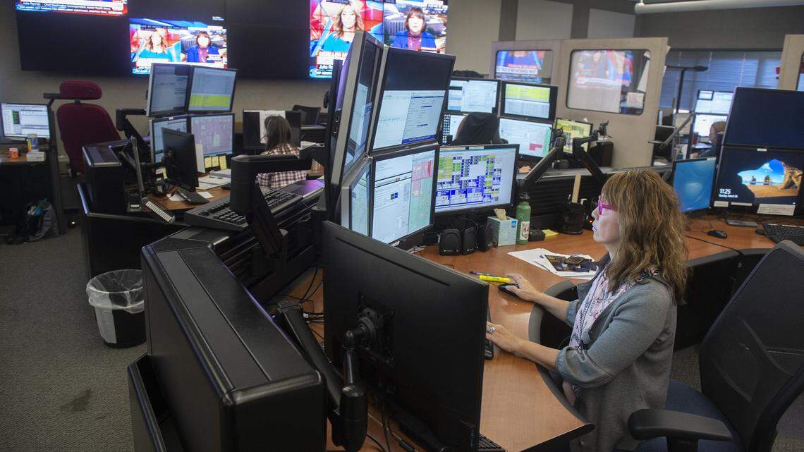Call taker and trainer Kim Barnard monitors calls at the South Sound 911 emergency call center in Tacoma on Tuesday, March 26, 2019.