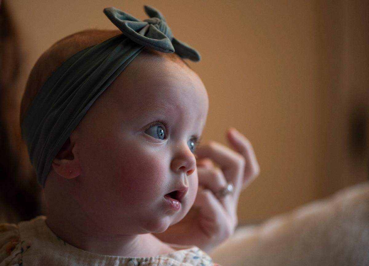 Winona Thigpen looks out the window at home with parents, on Wednesday, April 24, 2024, in Gig Harbor. In October 2023, her parents Annie and Abraham were accused of abusing their then-5-week-old infant.