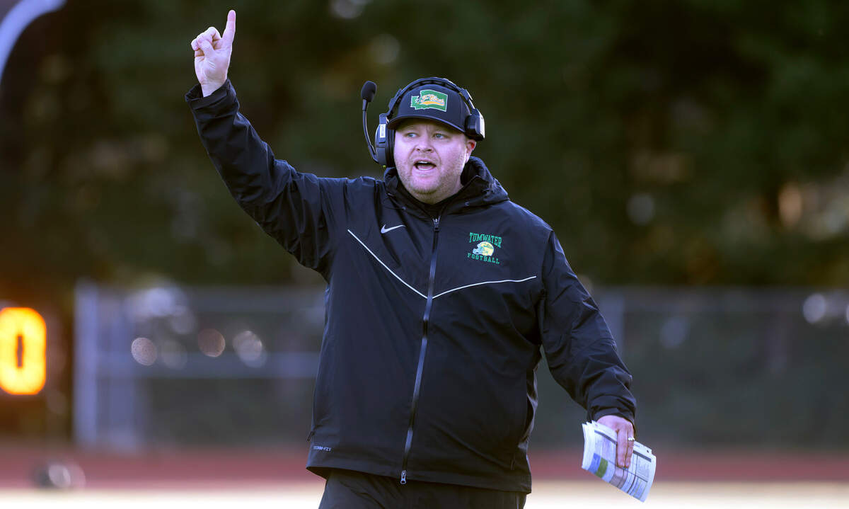 Tumwater head coach Willy Garrow directs the T-Birds during Satuday afternoon’s state playoff game against the Sehome Mariners at Tumwater District Stadium in Tumwater, Washington, on Friday, Nov. 23, 2024. Tumwater won the game, 70-7, to advance to the state semifinals.