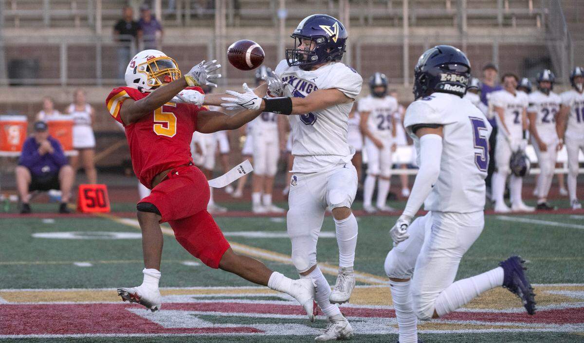 Mount Tahoma’s Deonjae Ervin battles North Kitsap defensive back fLogan Sloan for a pass during Friday night’s season-opening football game at Mount Tahoma High School in Tacoma, Washington on Sept. 1, 2023. North Kitsap won the game, 24-21.