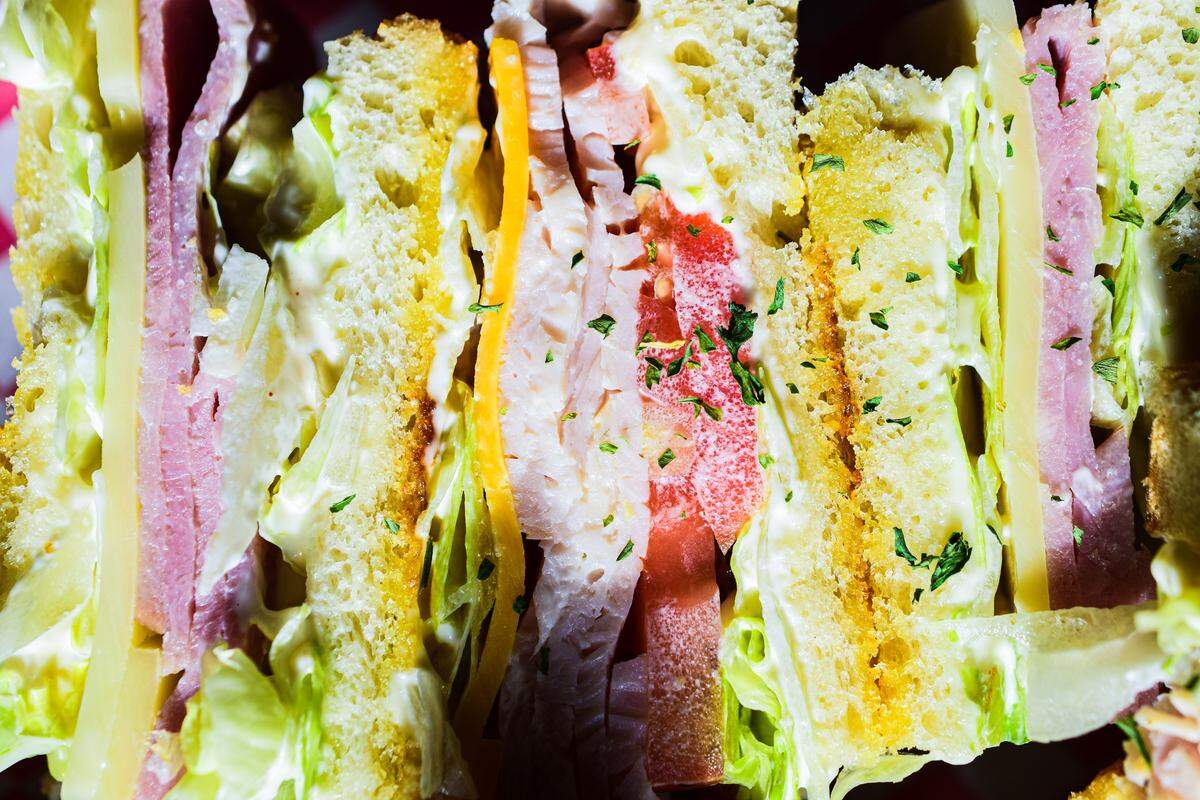“It’s getting all the pieces to line up — that’s the trick,” said chef Ryan Vincent of his Frontier Club, a six-layer specimen served stacked on two long skewers.
