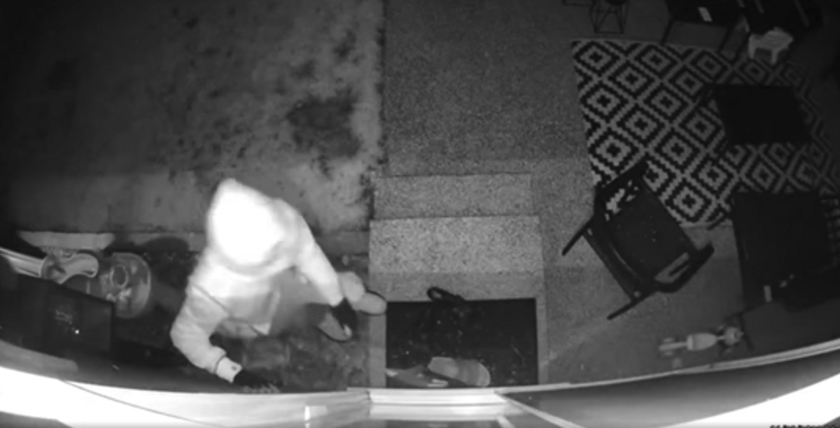 A still from a Gig Harbor home’s surveillance camera shows a man peering inside during a series of break-ins in November, 2021, near Borgen Loop.