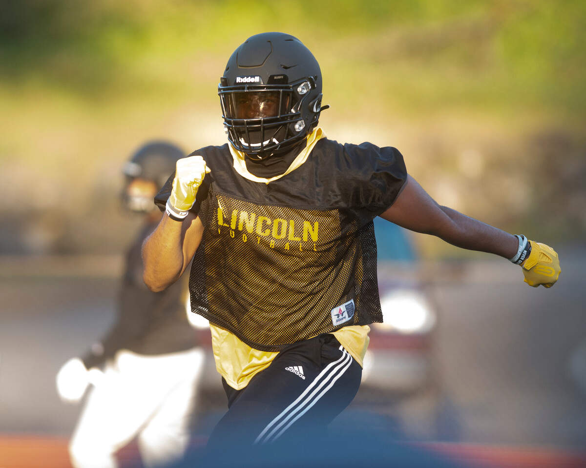 Lincoln receiver/defensive end Jayden Wayne runs drills during football practice at Lincoln High School in Tacoma, Washington on Wednesday, Feb. 10, 2021.