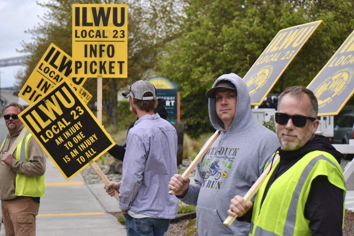 Members of the International Longshore & Warehouse Union take part in an informational picket.