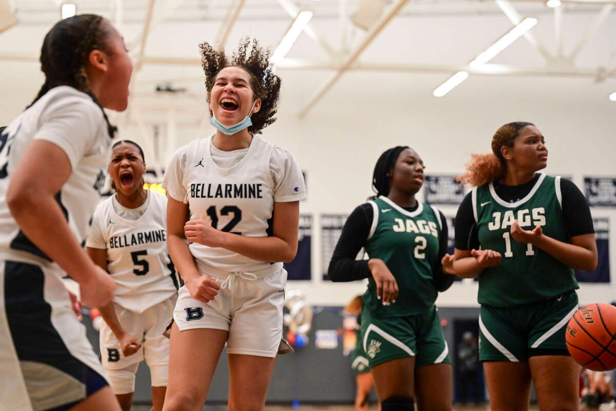 Bellarmine Prep forward Stella Wiggins (12) and guard Kiara Stone (5) celebrate after guard Jada Travis (23) was fouled while making a layup as Emerald Ridge guard Kali Haizlip (2) and guard Marecia Barnett (11) look toward the referee for an explanation during the second quarter of a 4A South Puget Sound League game on Friday, Jan. 28, 2022, at Bellarmine Prep, in Tacoma, Wash.