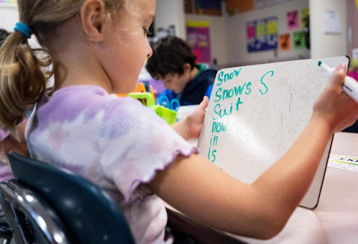 First grade student Addie Airey practices finding words within another word during her Enhanced Core Reading Instruction training (ECRI) class at Harbor Heights Elementary in Wollochet, Wash. on Friday, June 3, 2022.