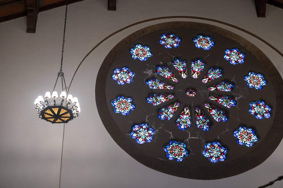 Stained-glass windows, tall vaulted wooden ceilings and antique iron chandeliers decorate the sanctuary of First Presbyterian Church Tacoma on Tuesday, June 30, 2026, in Tacoma, Wash.