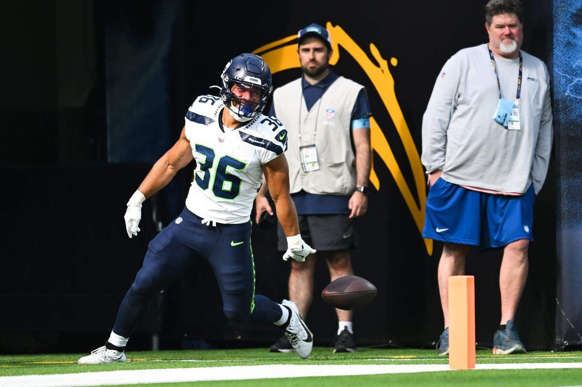 Aug 10, 2024; Inglewood, California, USA; Seattle Seahawks running back George Holani (36) makes a touchdown against the Los Angeles Chargers during the second quarter at SoFi Stadium. Mandatory Credit: Jonathan Hui-USA TODAY Sports