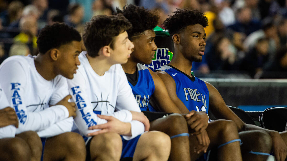 Federal Way’s Jaden McDaniels and Tari Eason sit on the bench after fouling out in the fourth quarter. Federal Way played Gonzaga Prep in a basketball game at the Hardwood Classic State Basketball Tournament at the Tacoma Dome in Tacoma, Wash., on Friday, March 1, 2019.