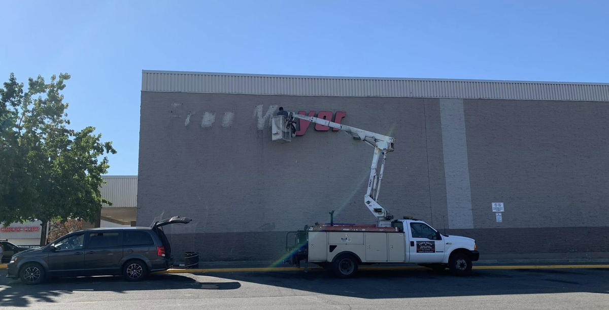 Workers on Wednesday removed the Fred Meyer sign from the store building at 7250 Pacific Ave. in Tacoma. The store, which dates back to the 1970s, ceased operations Wednesday.