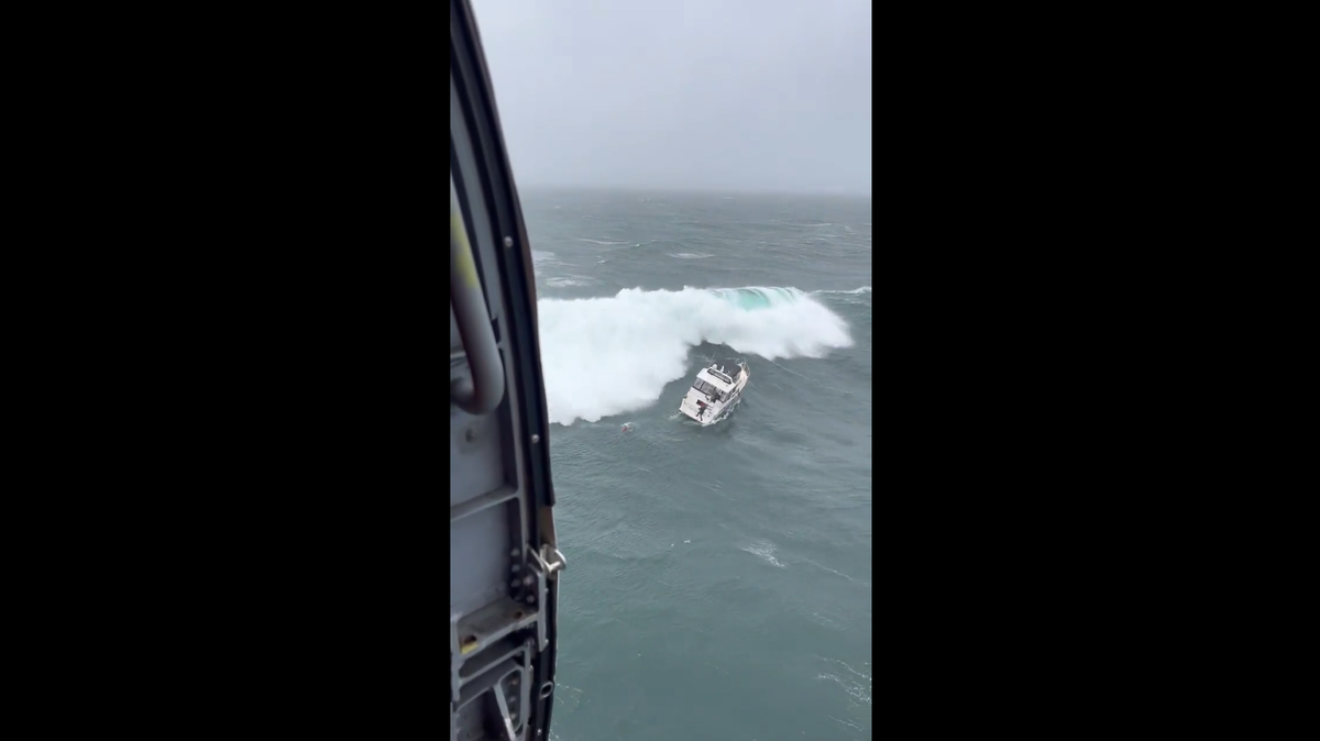 U.S. Coast Guard training crews rescued a nearby boater from nearly 30-foot swells at the mouth of the Columbia River on Feb. 3.
