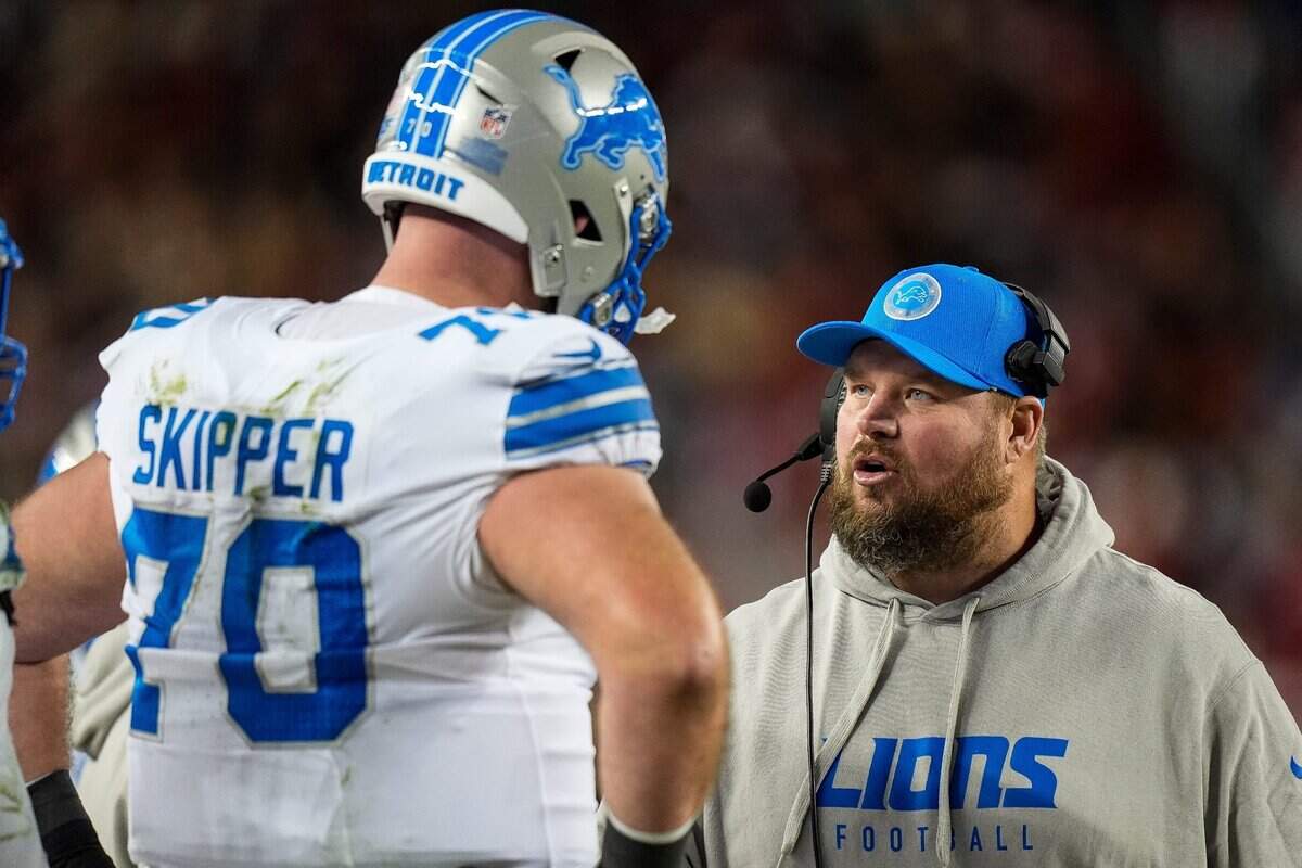 Detroit Lions offensive tackle Dan Skipper (70) talks to offensive line coach Hank Fraley during the second half against San Francisco 49ers at Levi's Stadium in Santa Clara, Calif. on Monday, Dec. 30, 2024.