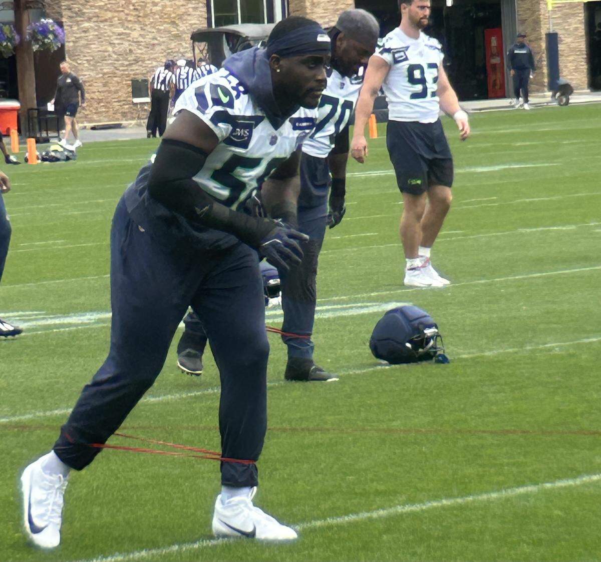 Derick Hall warms up for practice during Seattle Seahawks organized team activities (OTAs) Wednesday, June 3, 2026, at the Virginia Mason Athletic Center in Renton hours after the linebacker re-signed with the Super Bowl champions for three years and $42 million, with $21 million guaranteed.