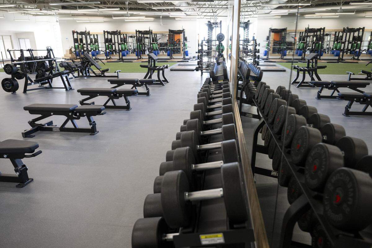 The strength-training area of the new Tacoma Pearl Street Family YMCA building spans across the building's second floor on Dec. 30, 2025, in Tacoma, Wash. The area includes a turf training space, free weights and dozens of other workout machines.