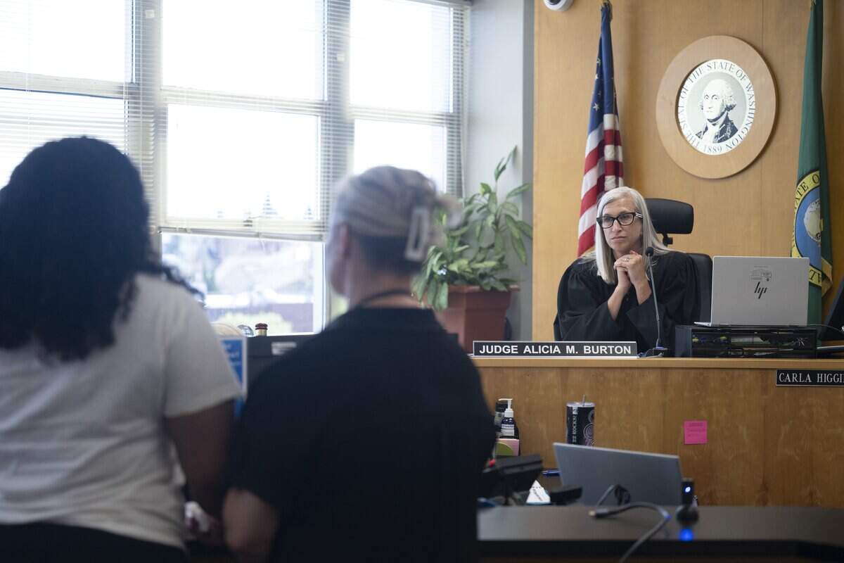 Judge Alicia Marie Burton, right, listens to family members and friends of Chantelle Grayson speak at the sentencing of Bobby Joe Ezra Plain, not pictured, on Friday, July 10, 2026, at Pierce County Superior Court in Tacoma, Wash. Plain pleaded guilty in April to first-degree manslaughter for the May 15, 2023 fatal shooting of 28-year-old Grayson near Tacoma's Sixth Avenue.