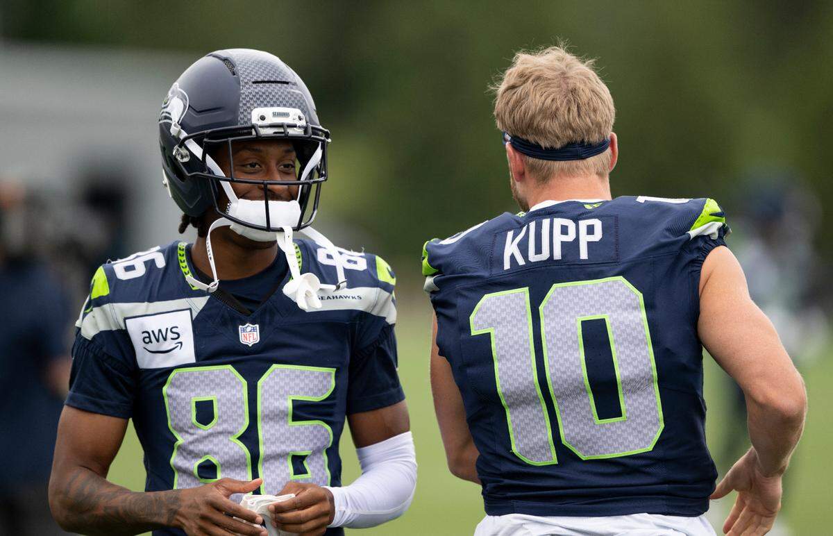 Seattle Seahawks wide receiver Ricky White III (86) and wide receiver Cooper Kupp (10) talk during training camp at Virginia Mason Athletic Center on Friday, July 25, 2025, in Renton, Wash.