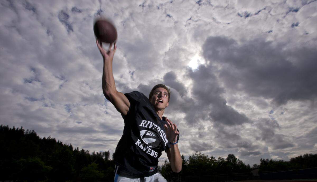 Quarterback Kevin Thomson fires a pass at Auburn Riverside High School on Tuesday, Sept. 17, 2013.