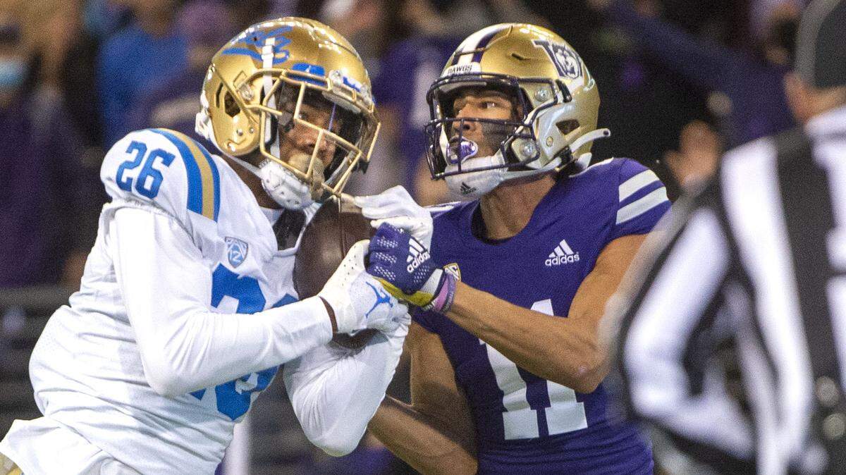 Bruins defensive back Devin Kirkwood intercepts a pass intended for receiver Jalen McMillan inside the Bruins’ 10-yard-line. UCLA’s second interception of quarterback Dylan Morris thwarted a late fourth-quarter scoring opportunity Saturday, Oct. 16, 2021. The Bruins won 24-17.