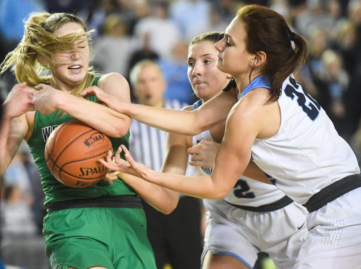 Woodinville’s Mia Hughes loses a rebound as she’s fouled during the third quarter. Woodinville played Central Valley in the 4A girls championship game at the Hardwood Classic state basketball tournament at the Tacoma Dome in Tacoma, Wash., on Saturday, March 7, 2020.