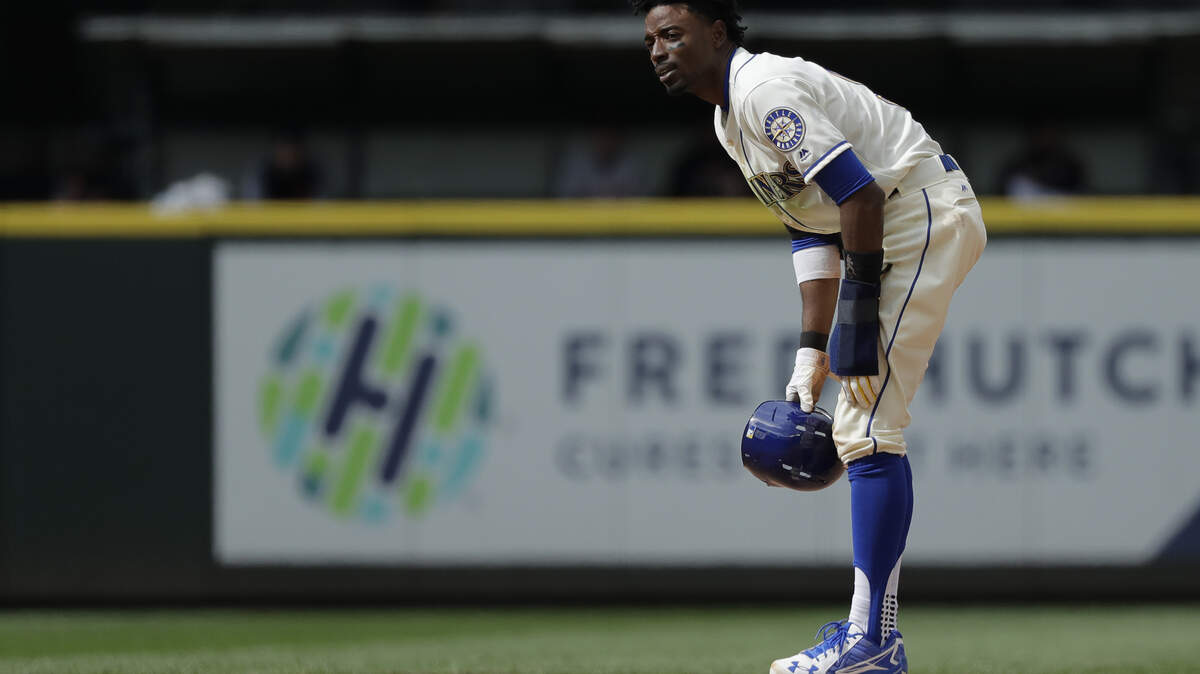 Seattle Mariners' Dee Gordon stands on second base after stealing in the 11th inning of a baseball game against the Detroit Tigers, Sunday, May 20, 2018, in Seattle. Gordon scored from second on a walk-off RBI single hit by Jean Segura and the Mariners won 3-2 in 11 innings. (AP Photo/Ted S. Warren)