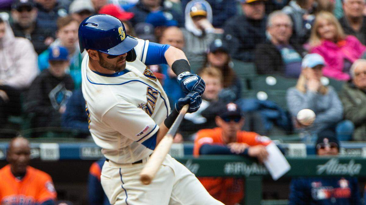Mitch Haniger hits a double in the third inning. The Seattle Mariners played the Houston Astros in a Major League Baseball game at T-Mobile Park in Seattle, Wash., on Sunday, April 14, 2019.