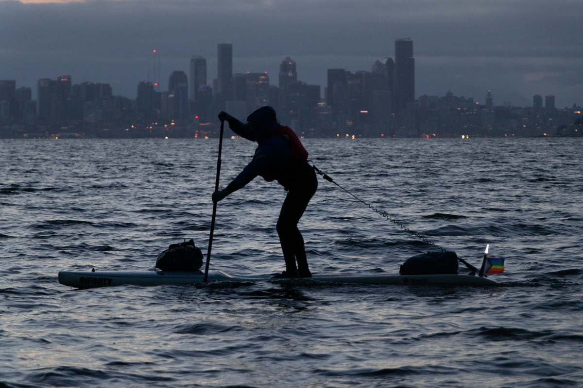 A lone stand-up paddleboarder making his way across Elliott Bay.