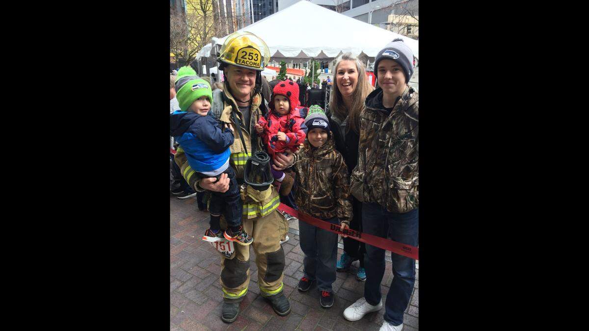 Tacoma firefighter Robert “Bo” Schiemer photographed with his family. From right to left, Finley, Bo, Elloise, Jeep, Melissa and Will.