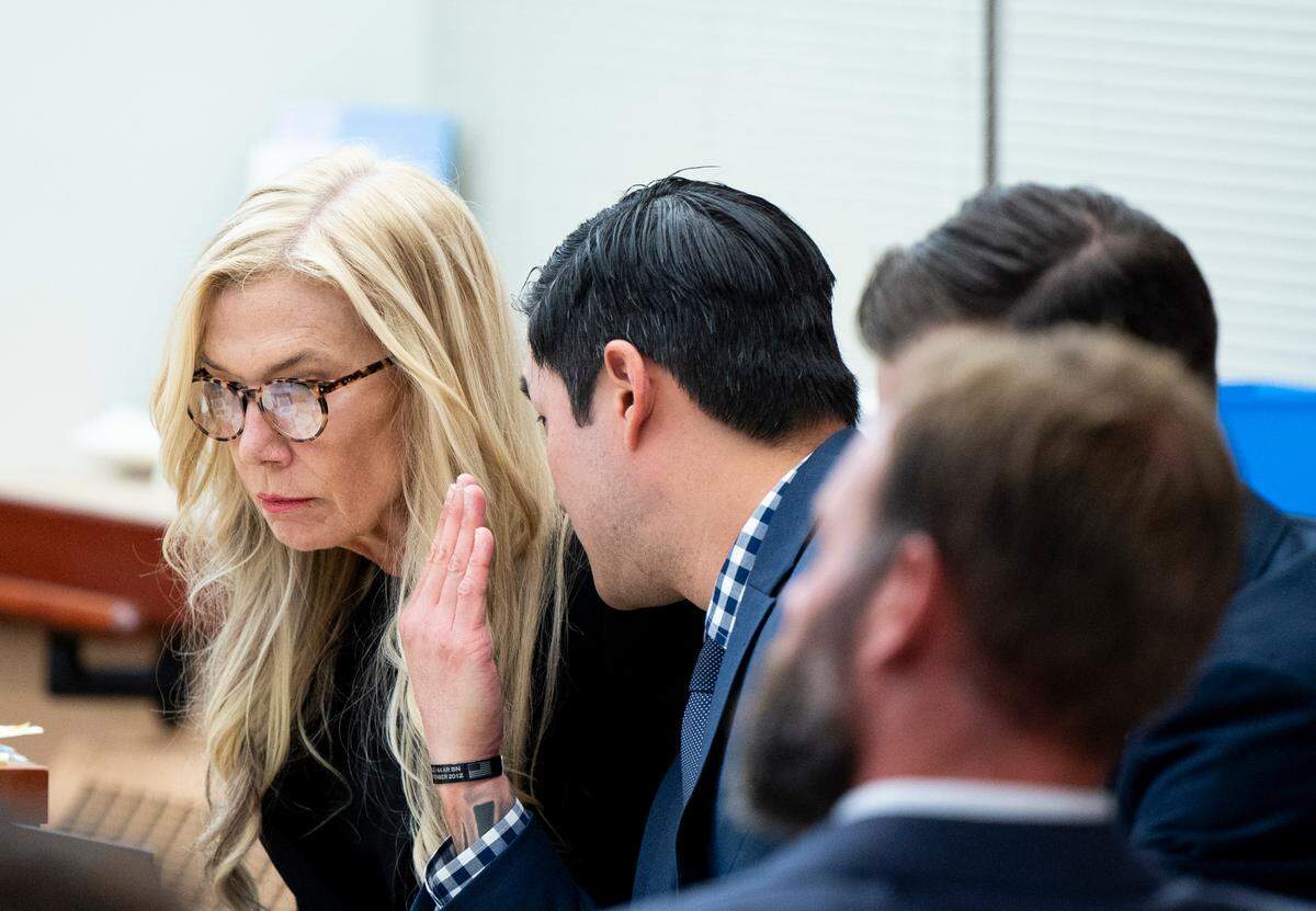 Defendant Timothy Rankine whispers to defense attorney Anne Bremner on Tuesday in Pierce County Superior Court.