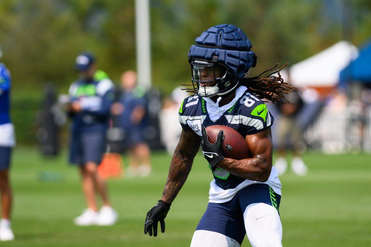 Jul 27, 2024; Renton, WA, USA; Seattle Seahawks wide receiver Laviska Shenault Jr. (81) carries the ball after making a catch during training camp at Virginia Mason Athletic Center. Mandatory Credit: Steven Bisig-USA TODAY Sports
