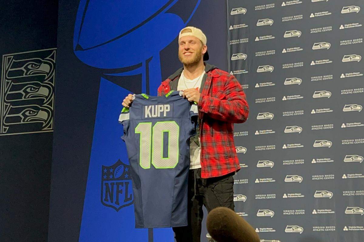 Newest Seahawks wide receiver Cooper Kupp displaying his familiar jersey number 10 he wore as Super Bowl 56 MVP with the Los Angeles Rams, hours after he signed a three-year contract to be Seattle’s new number 10, at the team’s Virginia Mason Athletic Center in Renton March 18, 2025.