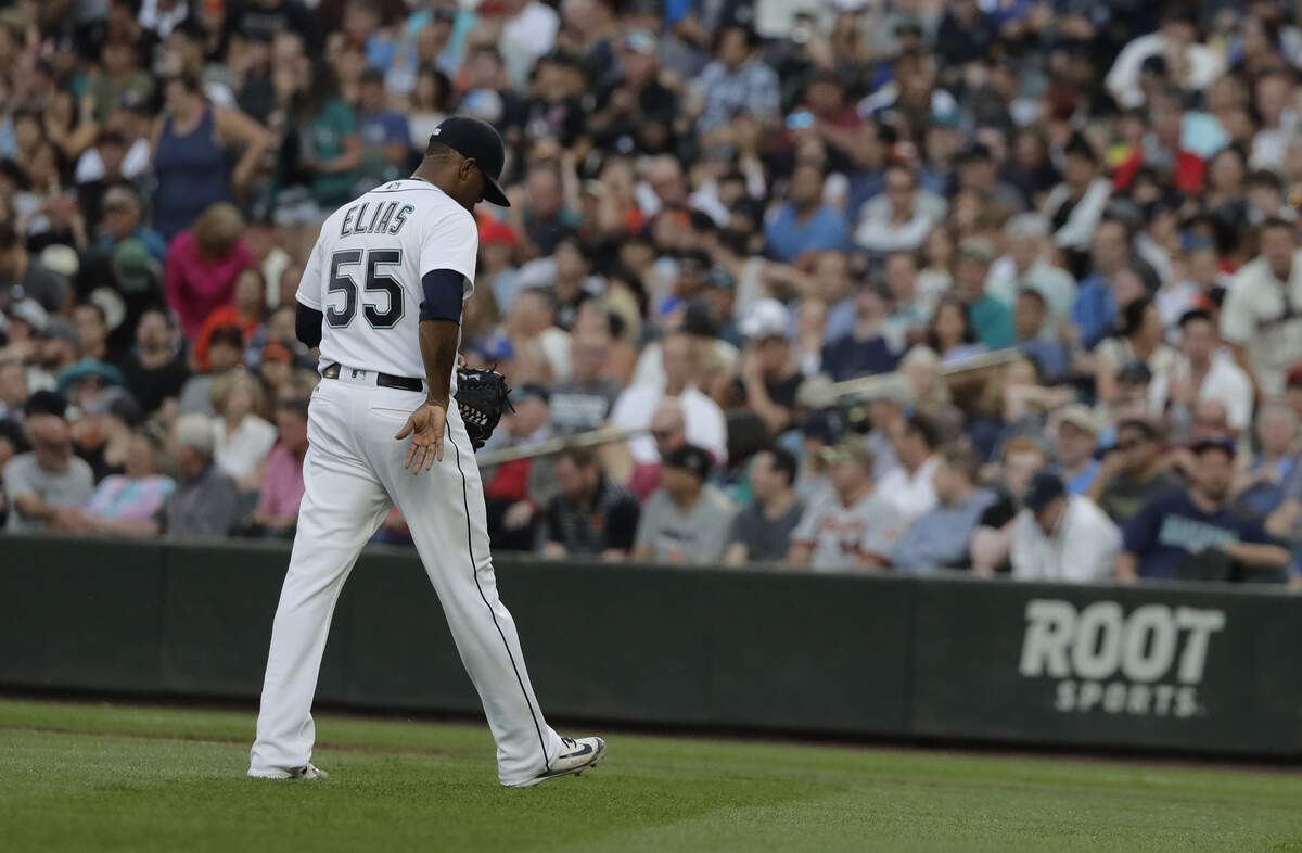 Seattle Mariners starting pitcher Roenis Elias walks to the dugout after he was pulled in the fourth inning of the team's baseball game against the San Francisco Giants, Tuesday, July 24, 2018, in Seattle. (AP Photo/Ted S. Warren)