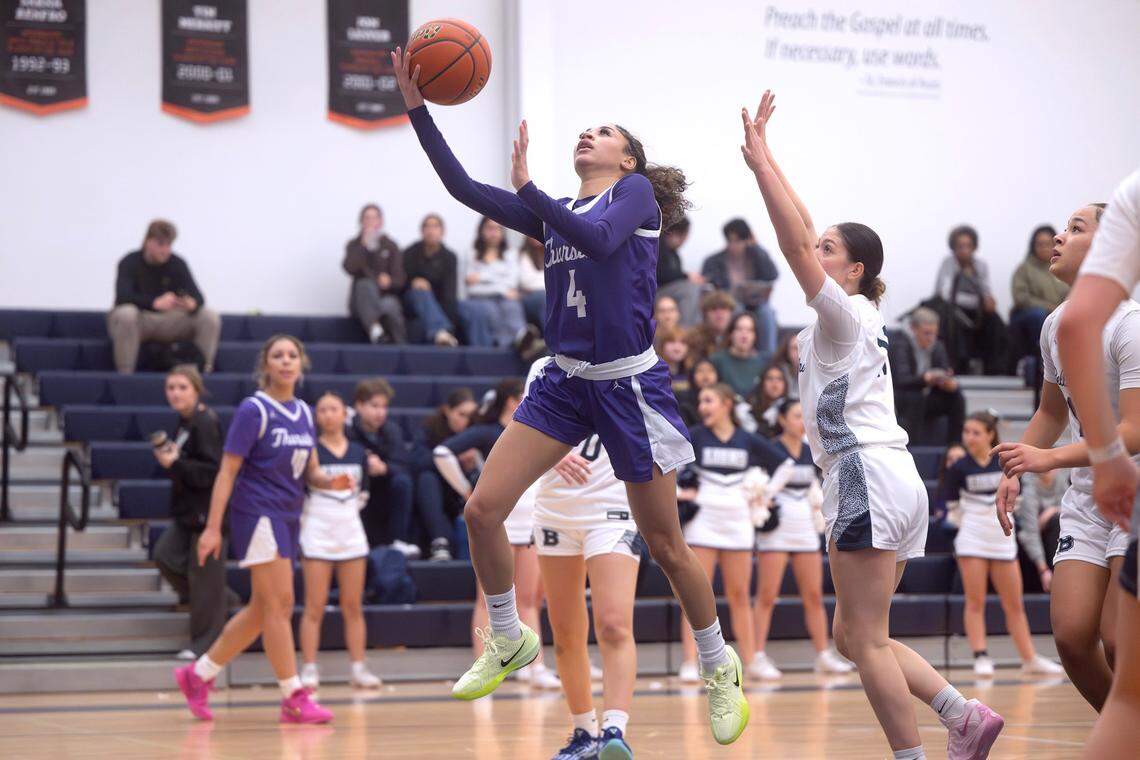 North Thurston’s Shayla Cordis flies to the basket in front of Bellarmine defender Kyla Frazier during Friday night’s girls basketball game at Bellarmine Preparatory School in Tacoma, Washington, on Jan. 17, 2025.