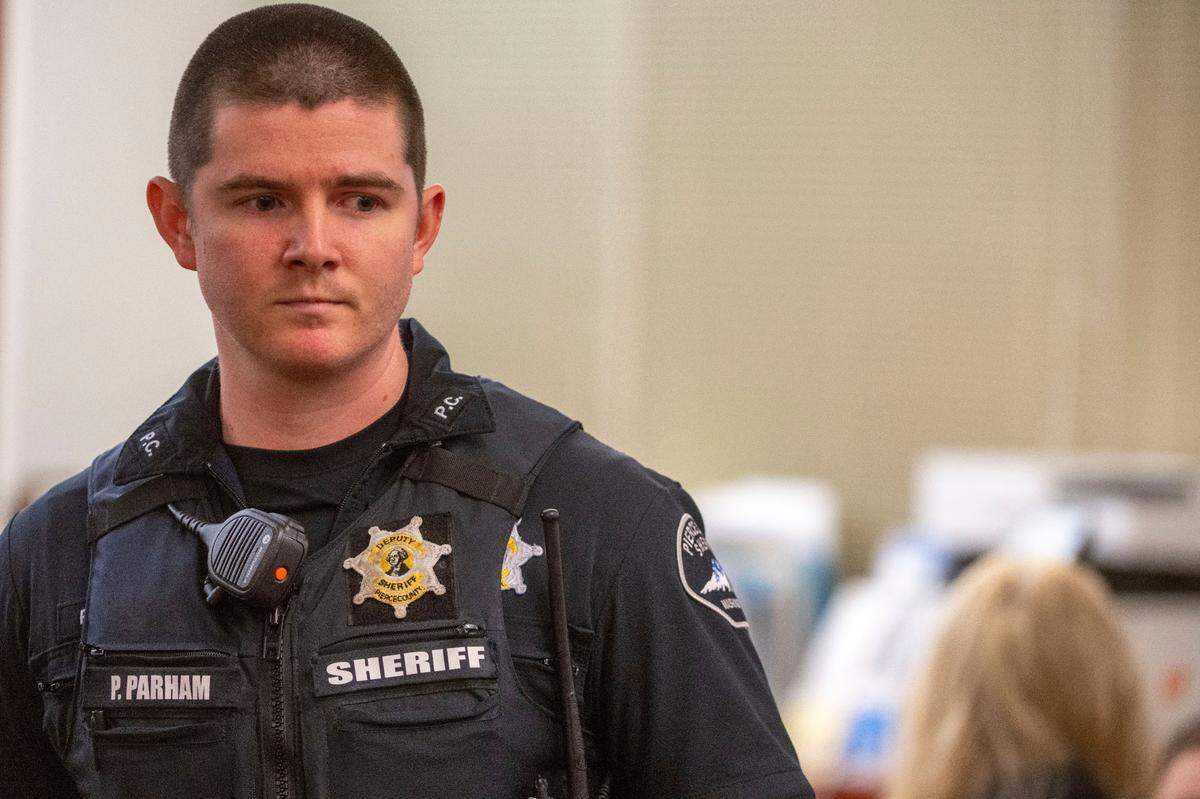 Pierce County Sheriff’s deputy Patrick Parham leaves the witness stand after testifying on Monday, Dec. 5, 2022, in Pierce County District Court in Tacoma.