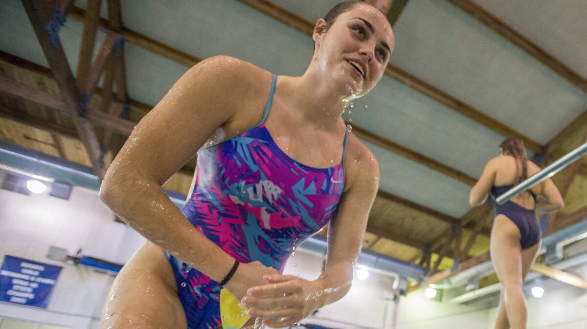 Rogers High School sophomore diver Heather Hopkins exits the pool in practice, September 17, 2018.  