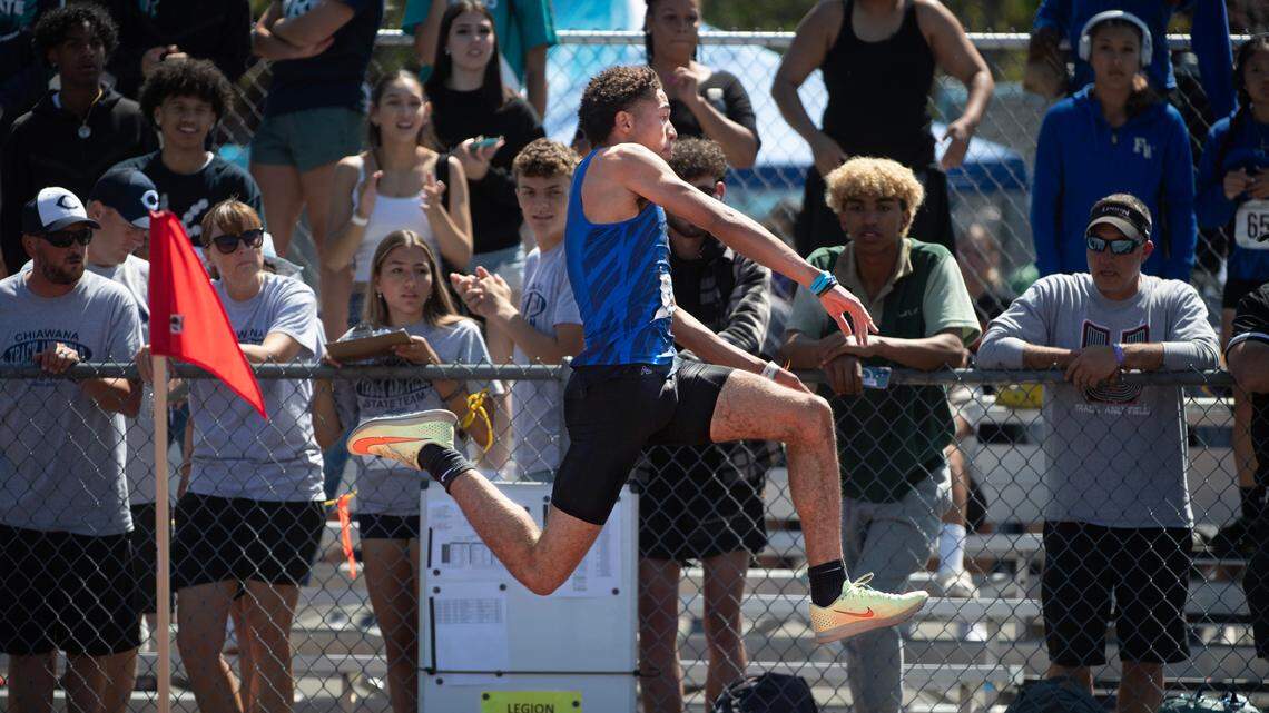 Federal Way’s Roman Hutchinson leaps to a state title in the 4A boys triple jump competition during the second day of the WIAA state track and field championships at Mount Tahoma High School in Tacoma, Washington, on Friday, May 26, 2023.