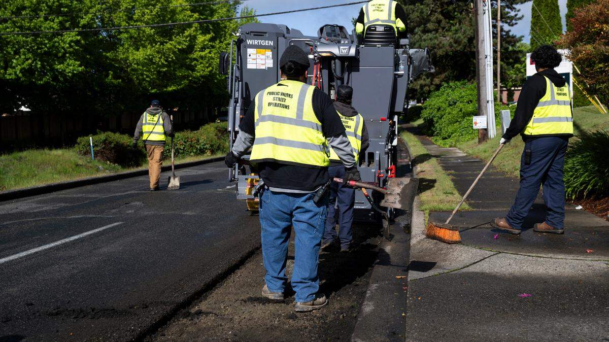 A Tacoma Public Works crew works to replace asphalt along North 21st Street in this 2024 file photo.