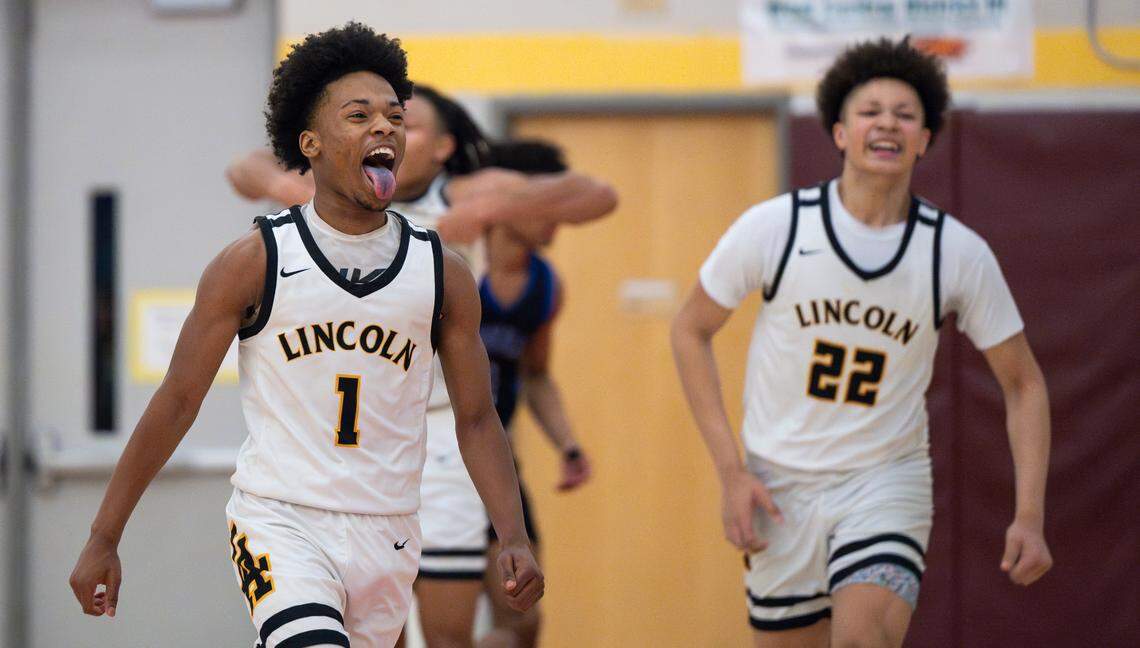Lincoln’s O’Shea Lamar (1) reacts to Lincoln win against Federal Way during the second half of the 3A District 3/4 tournament boys semifinal on Tuesday, Feb. 18, 2025, in Tacoma, Wash.
