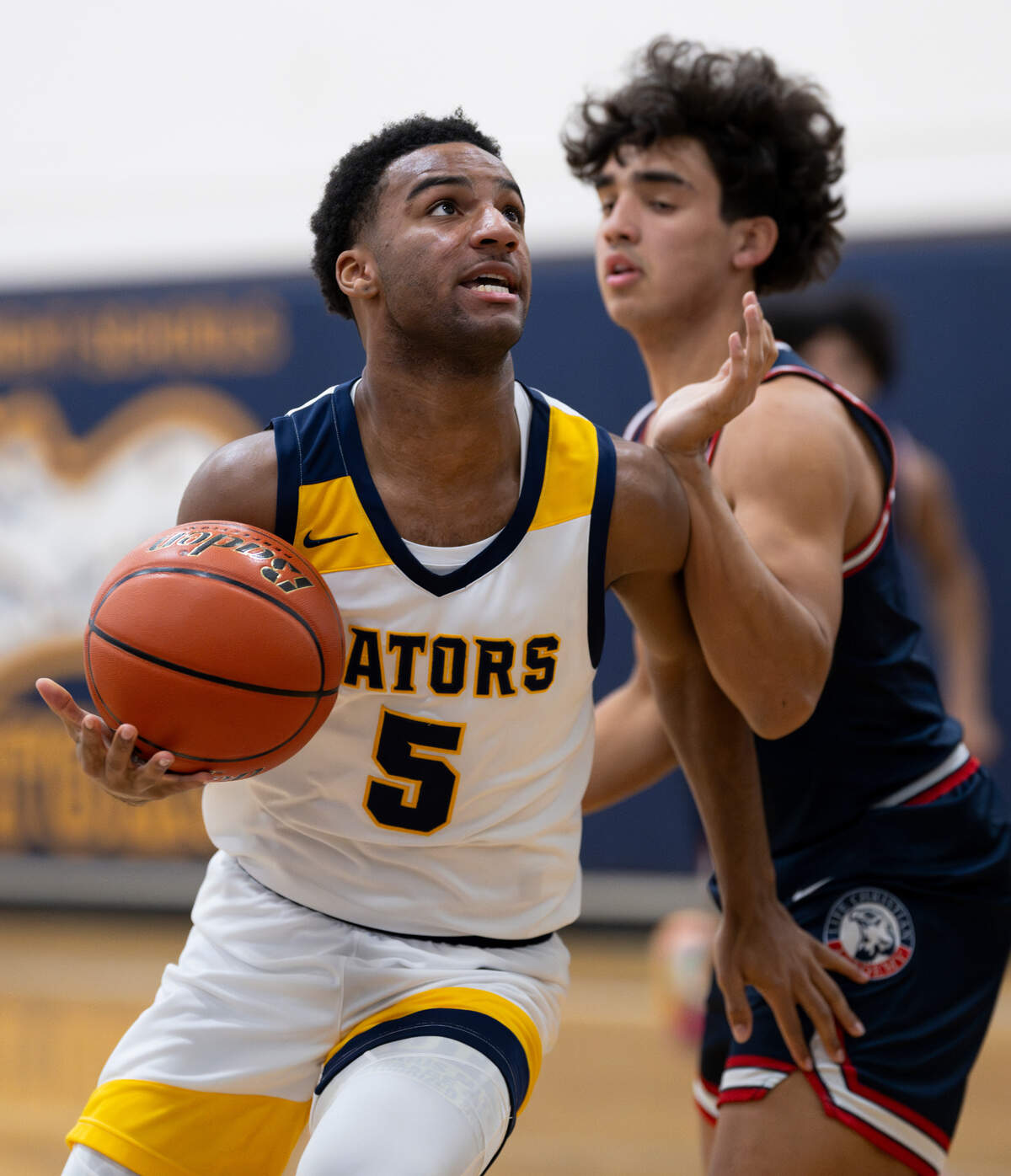 Annie Wright’s Reggie Lester (5) drives to the basket during the first half of the boy’s basketball game against Life Christian at Annie Wright School, on Thursday, Jan. 23, 2025, in Tacoma Wash.