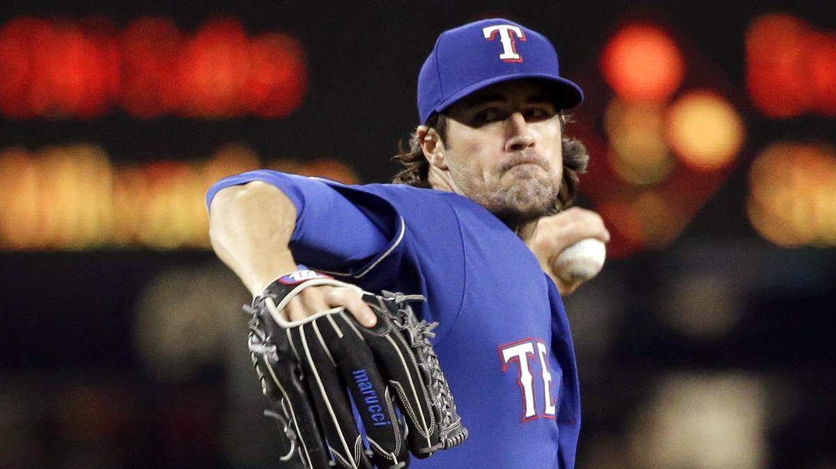 Texas Rangers starting pitcher Cole Hamels throws against the Seattle Mariners in a baseball game Thursday, Sept. 21, 2017, in Seattle. (AP Photo/Elaine Thompson)