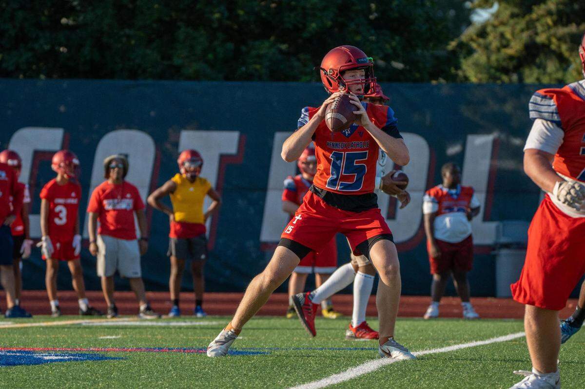 Kennedy Catholic quarterback Payton Faker looks to pass the ball in a drill during practice at the high school in Burien, Wash. on Wednesday Aug. 17, 2022.