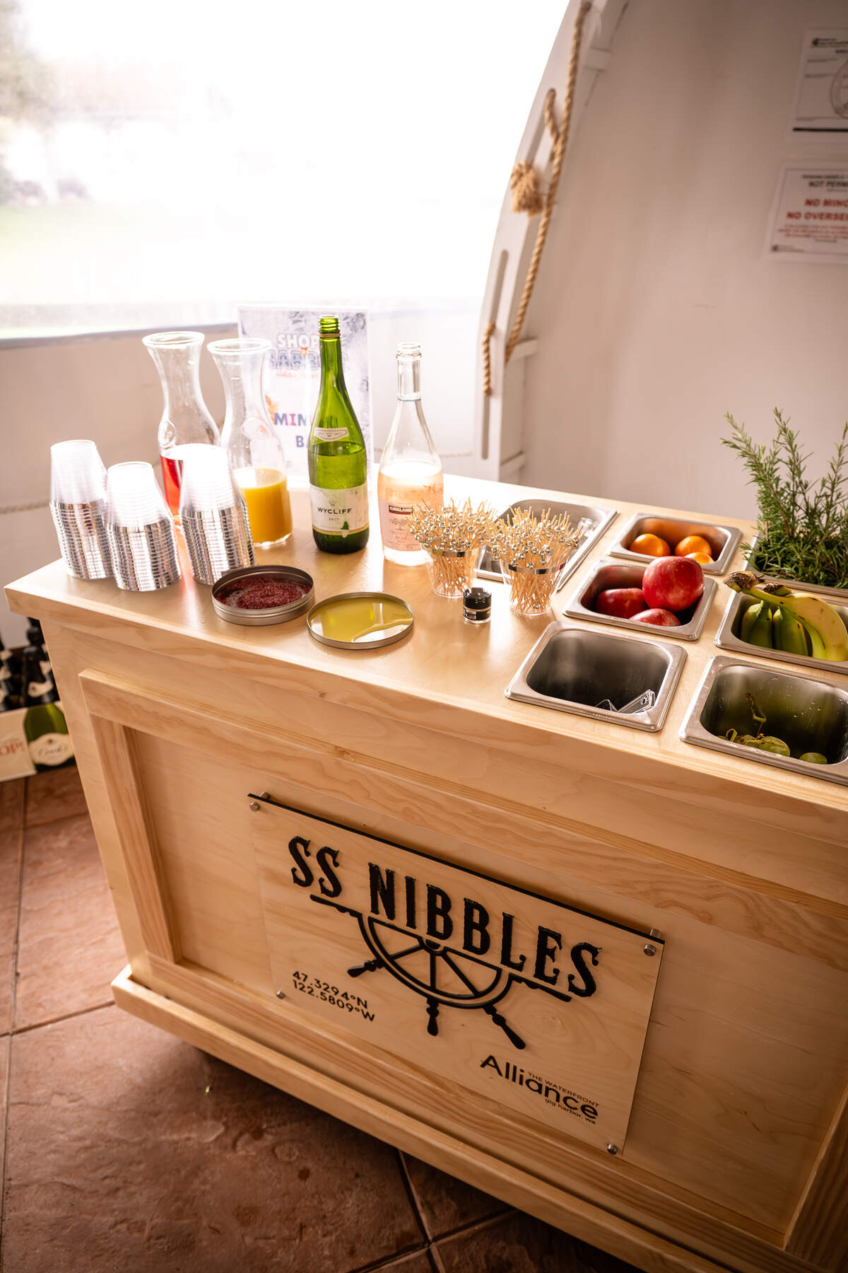 Trisha Radosavljevic, owner of Maeberry Design, engraved and built a charcuterie-style cart used in multiple events hosted by the Gig Harbor Waterfront Alliance, including their “Shop the Harbor” holiday shopping event.