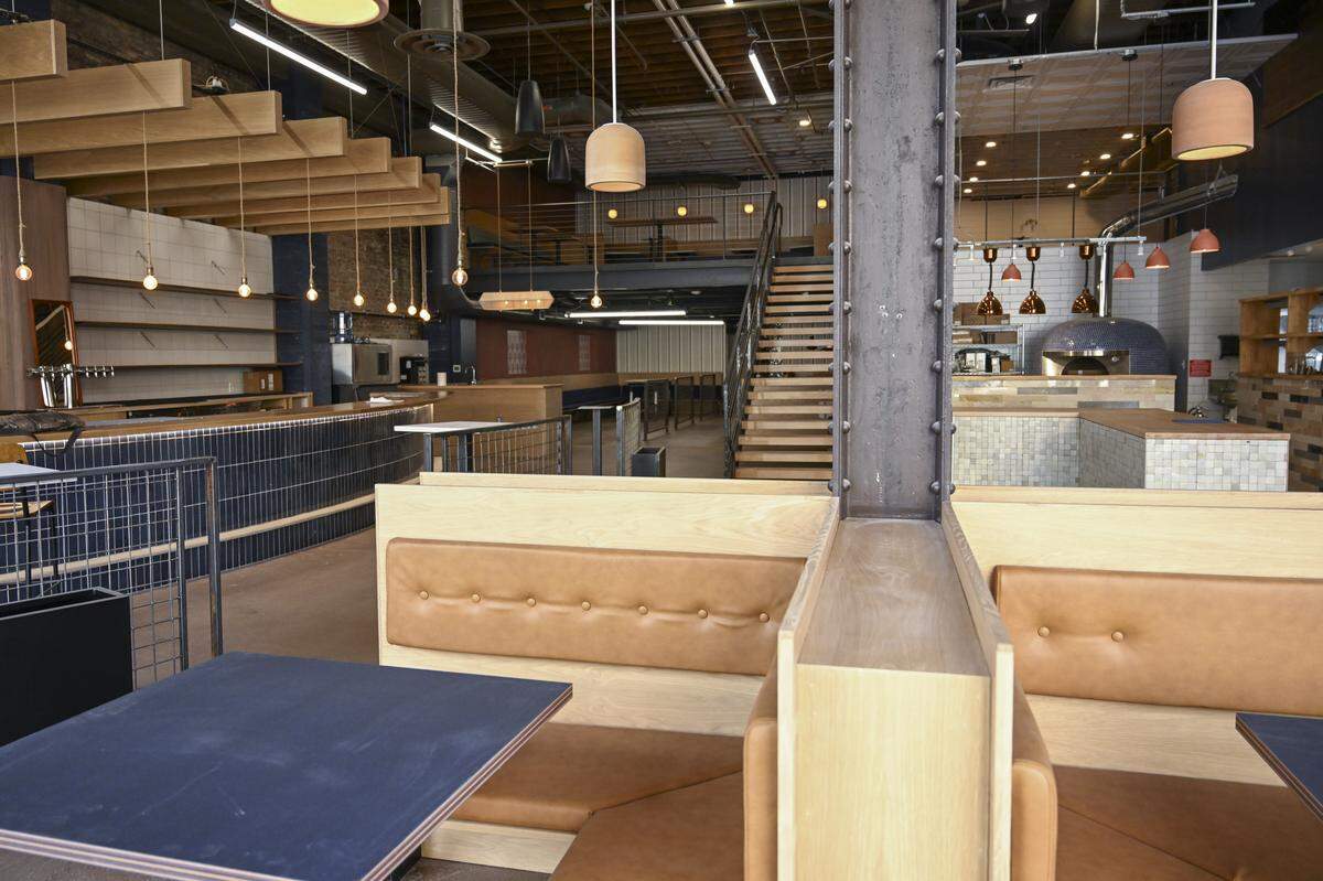 Wooden City will move into its new home at 1102 Broadway, shown on April 10 with some final touch-ups still to do, by May. The beating heart of the much bigger restaurant is the bar and lounge in the front, with a dining room in the back, an open kitchen and a mezzanine with private dining.