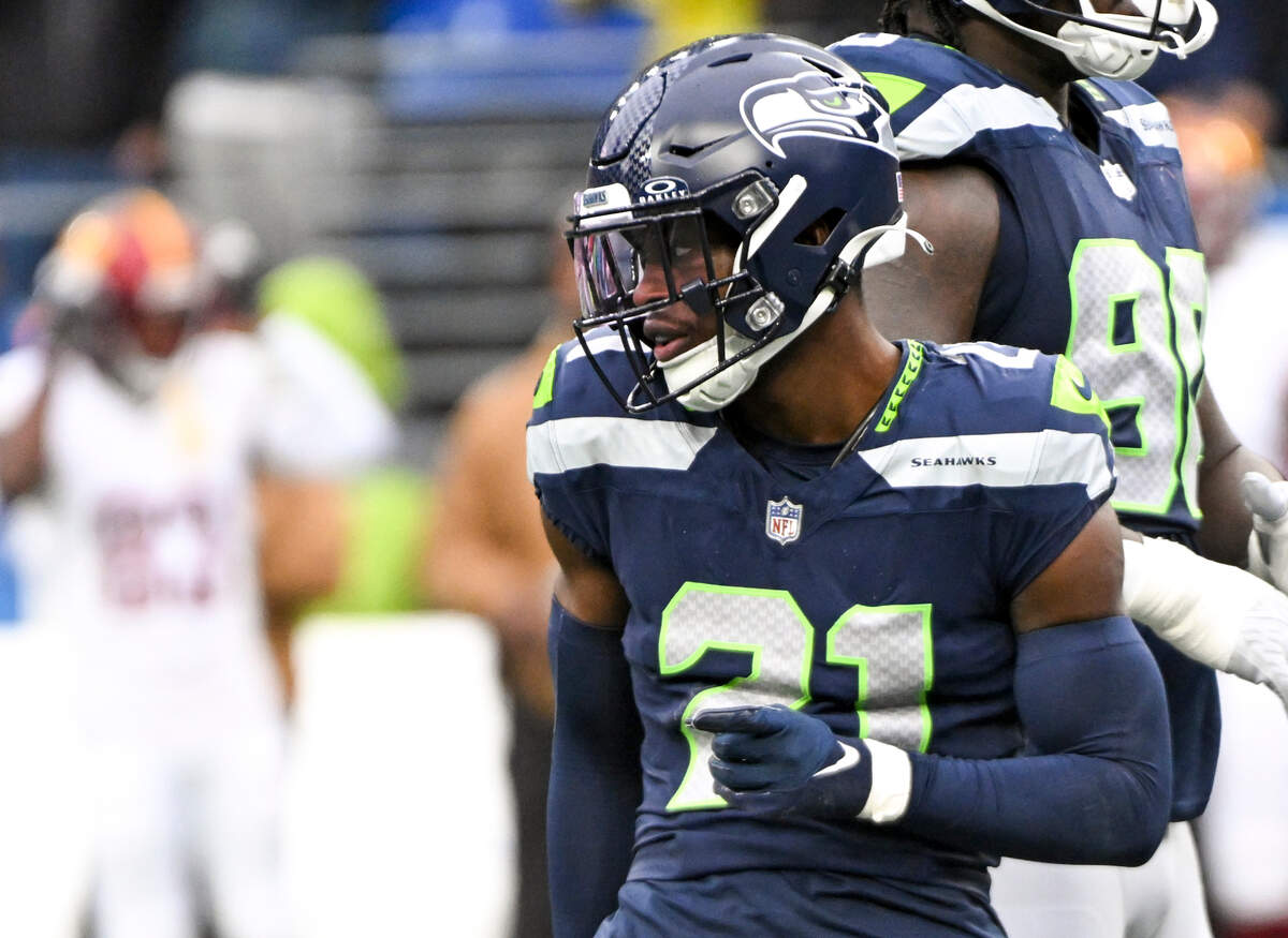 Seattle Seahawks cornerback Devon Witherspoon (21) reacts to breaking up a pass during the second quarter against the Washington Commanders of the game at Lumen Field, on Sunday, Nov. 12, 2023, in Seattle, Wash.