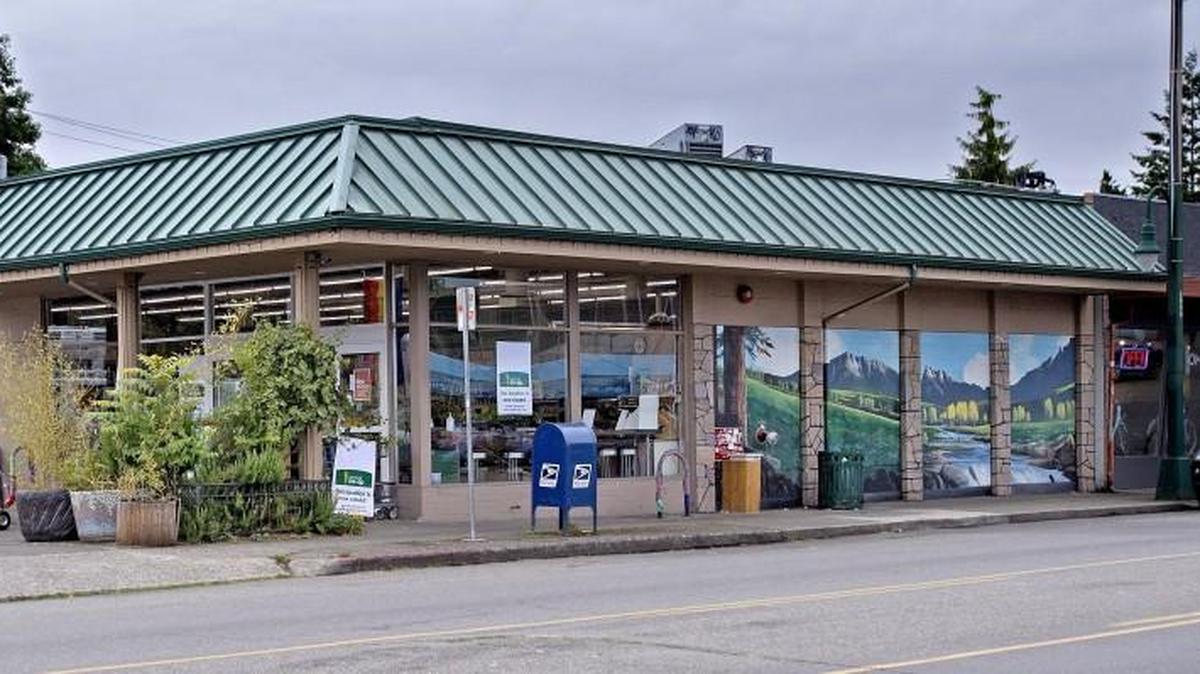 A closed store sign sits at the driveway at Central Co-op in Tacoma on July 18, 2016. Central Co-op is in negotiations for a new Tacoma market with a deli, coffee shop and expanded food services.