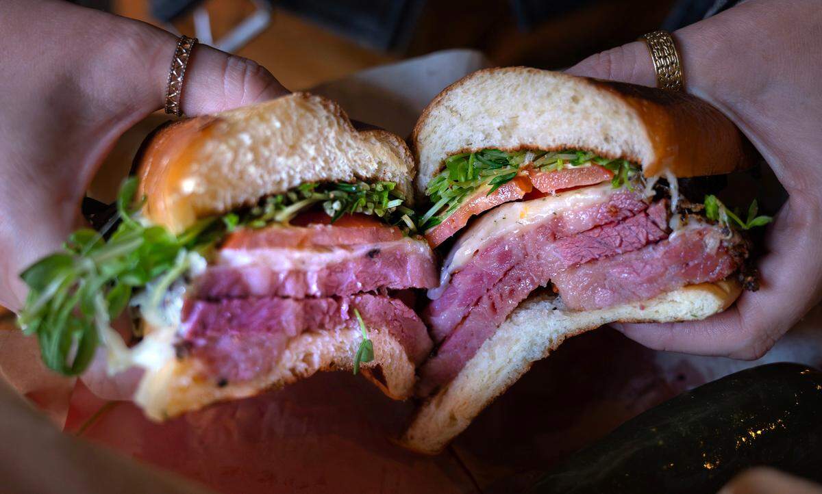 Trey Beattie couldn’t find pastrami that tasted like home, so he smoked it himself at Sandwich Starr. It’s featured in the Sir Robot with dill havarti, tomato, Dijon and microgreens.