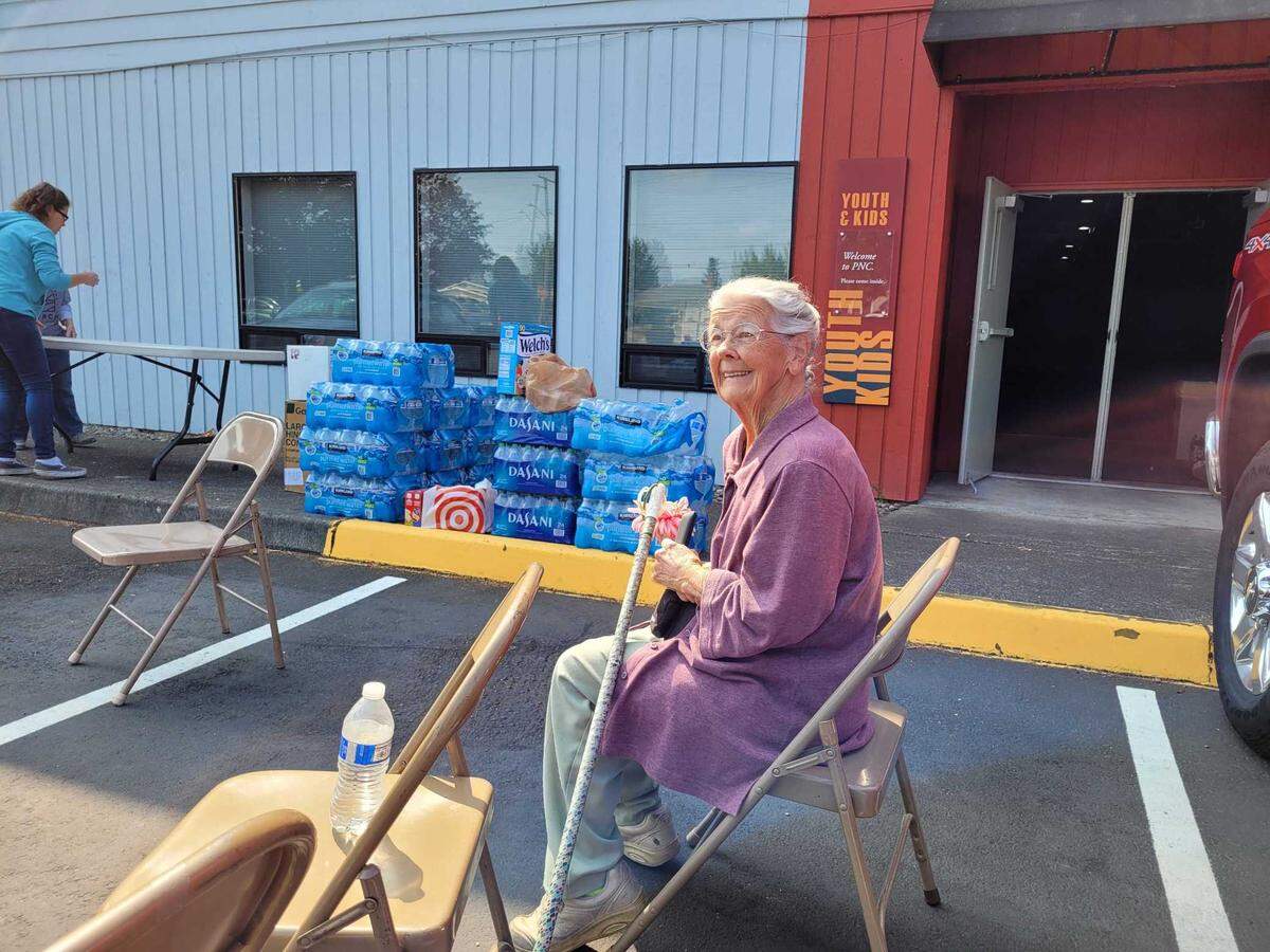 Glenda Blakely and others headed to the Puyallup Nazarene Church parking lot early Saturday, which was set up as a shelter for families who had to evacuate a 1.1 mile radius of the city due to a large fire.