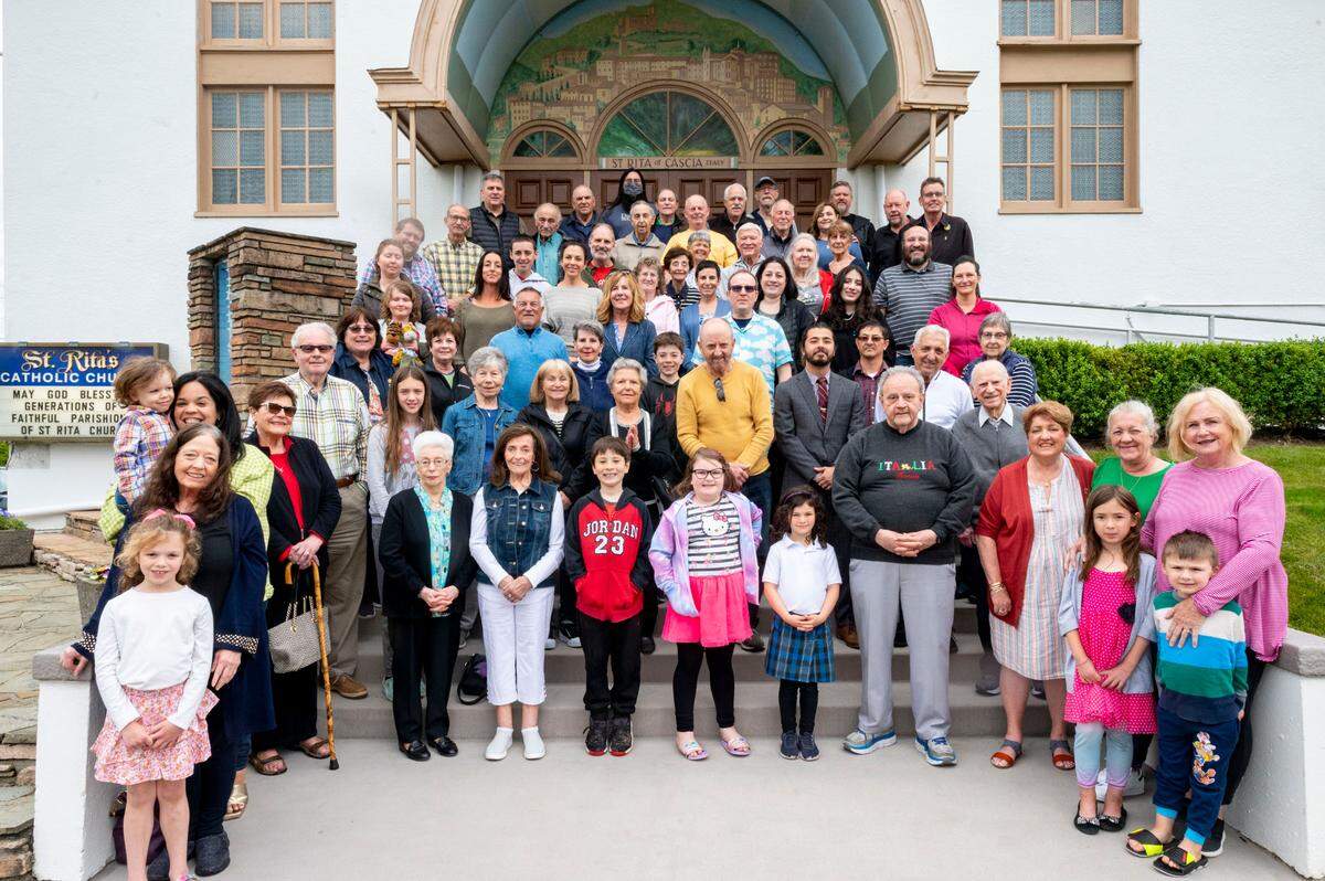 Parishioners of St. Rita of Cascia gather together for a group portrait on Tuesday, June 14, 2022, outside the church in Tacoma.
