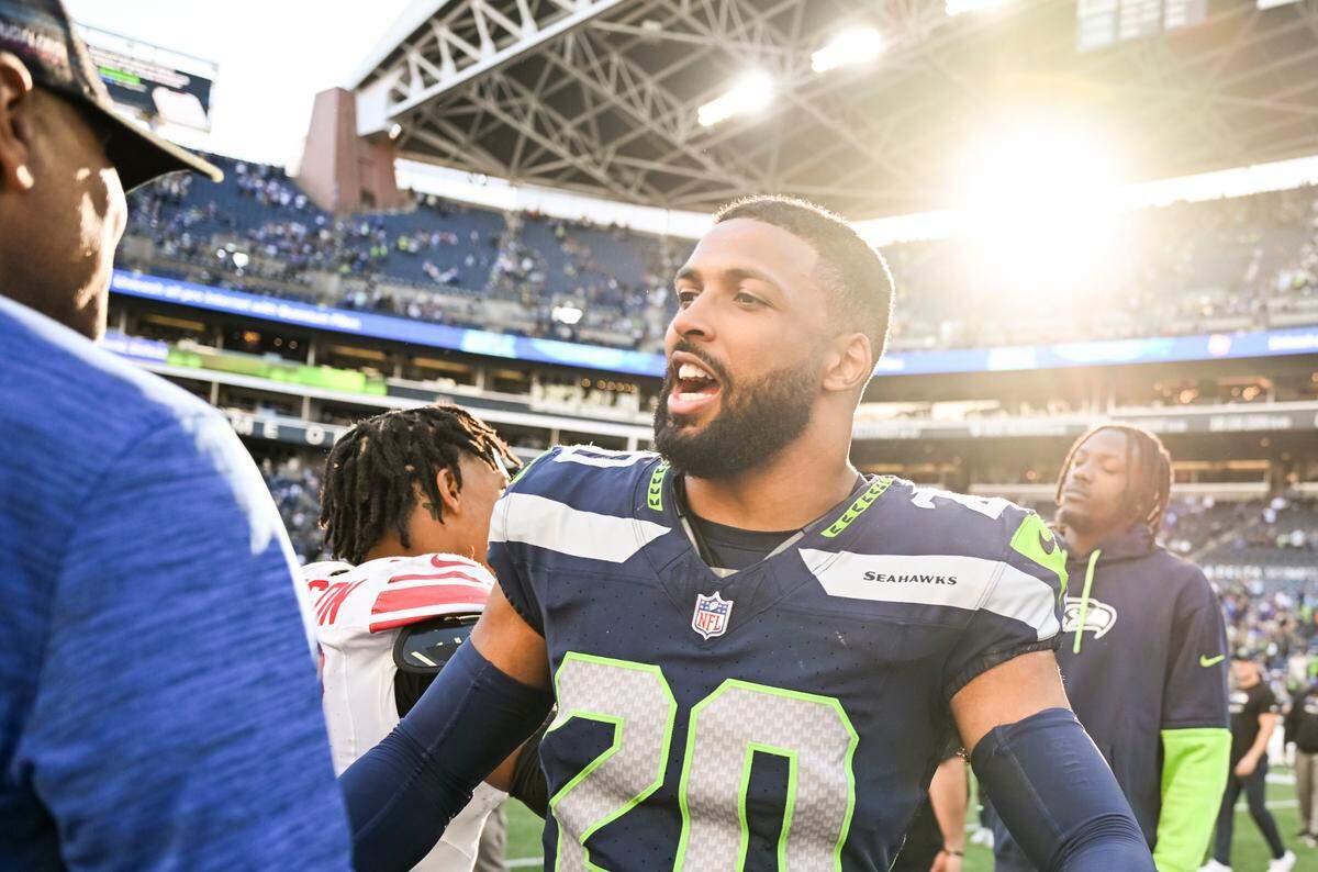 Former New York Giants Julian Love greats staff and players from his former team after the Giants 29-20 victory against the Seattle Seahawks at Lumen Field, on Sunday, Oct. 6, 2024 in Seattle, Wash.of the game at Lumen Field, on Sunday, Oct. 6, 2024 in Seattle, Wash.