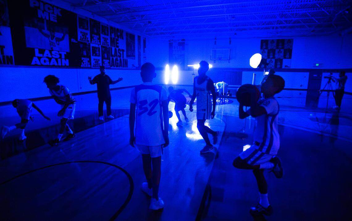 Members of the Slow Grind Elite AAU sixth-grade basketball team takes part in team photo and media day at the Al Davies Boys & Girls Club in Tacoma, Washington, on Saturday, Nov. 9, 2024.