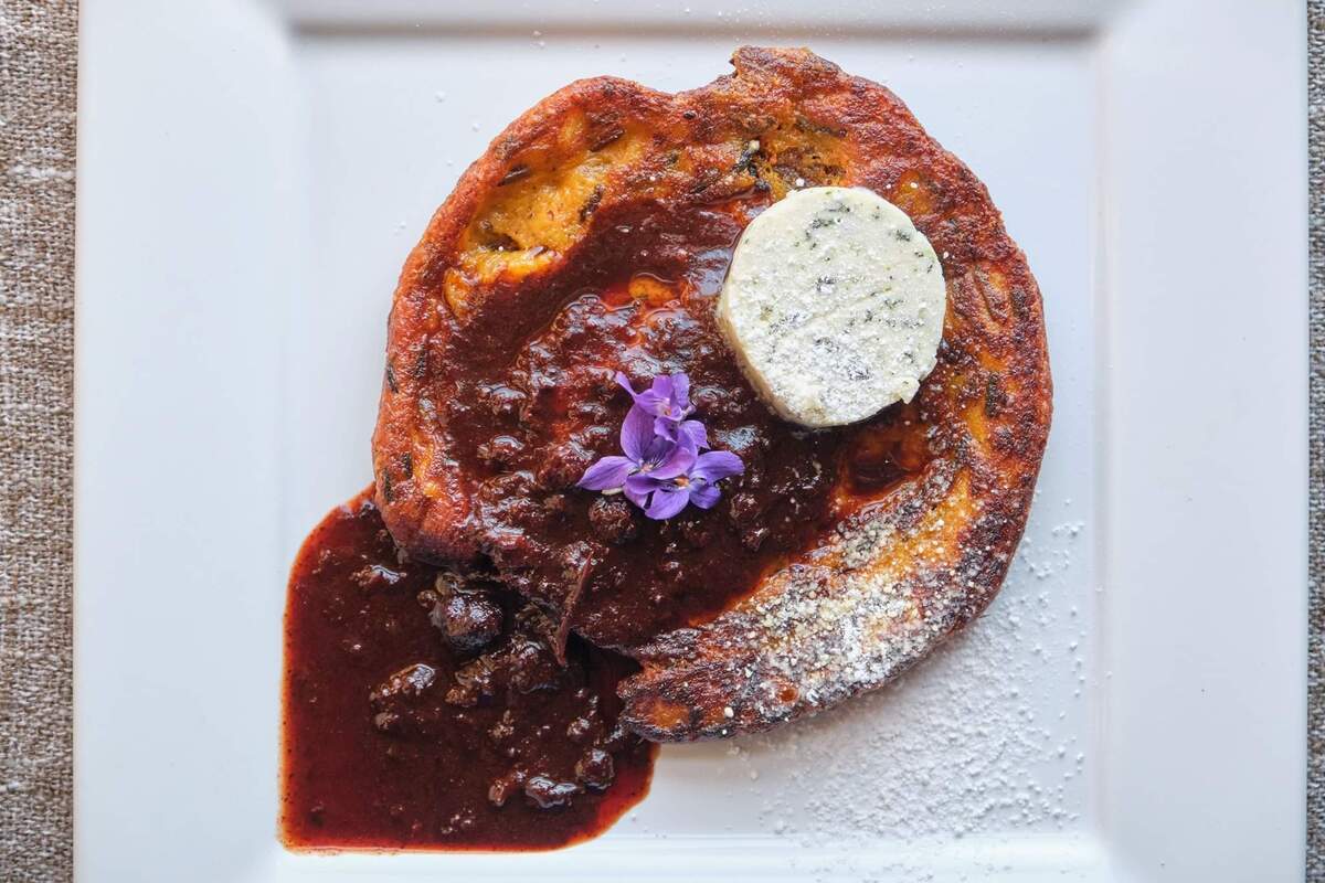 Dishes at the May 25 pop-up dinner at Holy Moly, such as this sweet potato and wild rice pancake with ancho-berry sauce, will pair with the indigenous chef’s storytelling.